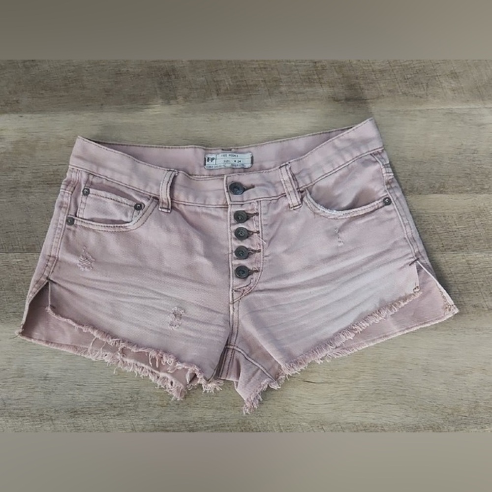 Free People Billie Chino Shorts in a pink or mauve color.